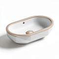 Oval freestanding soaking tub with rose gold trim and modern design 100 x 50 x 40cm